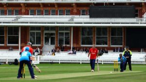 Mark Turnham batting against Mo Khatri's Bowling with the Lords Pavilion in shot