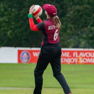 Somerset’s Kathryn Jelfs-White gathers the ball in the outfield.